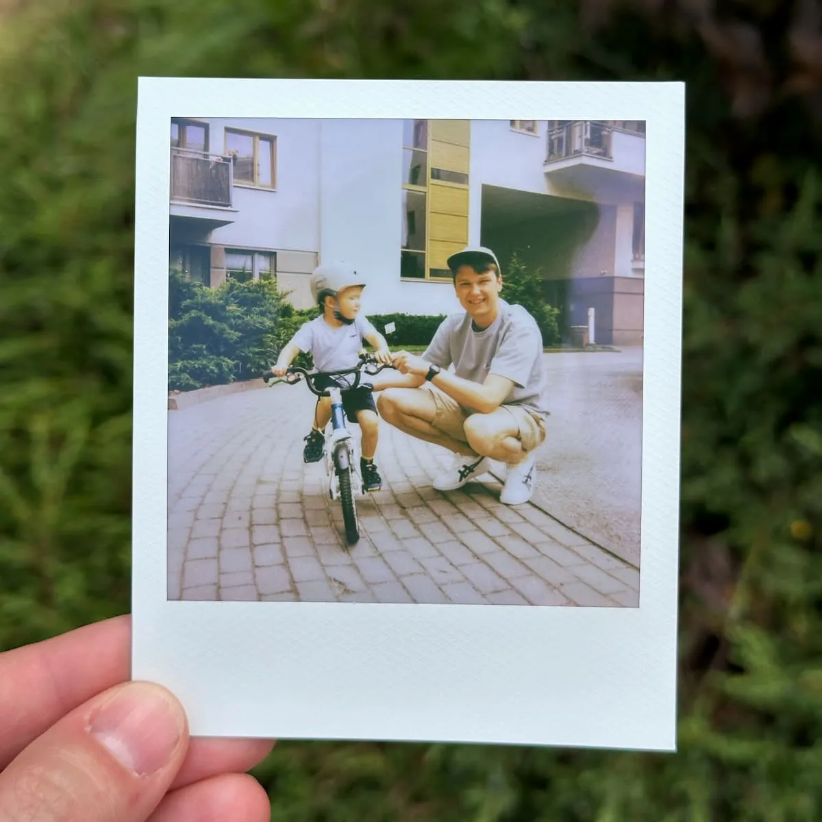 My son Peter on his bicycle and I